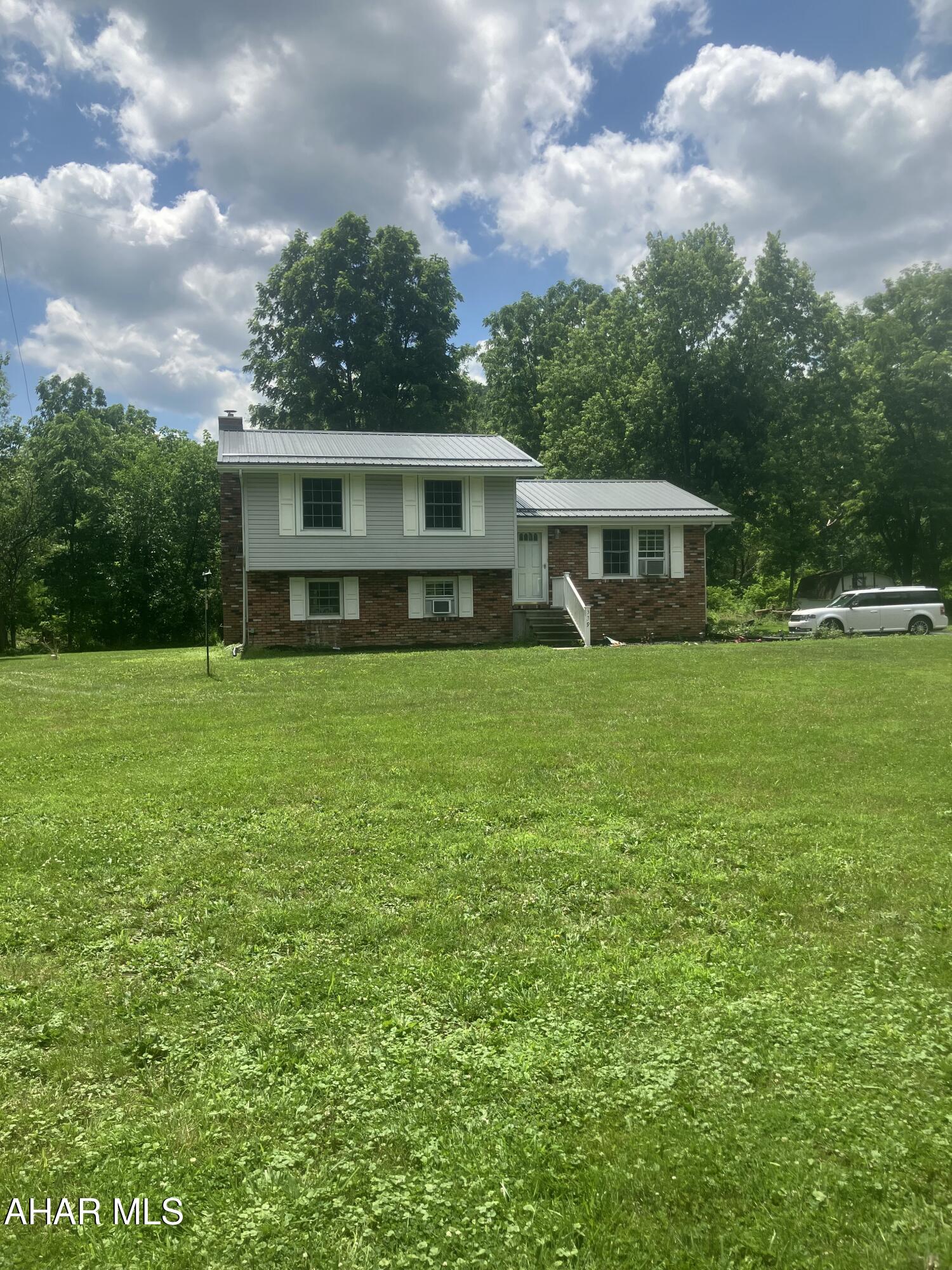 Back on the market by no fault of the home !! It passed all inspections for FHA!!
This bi level sits on almost a full acre, lots of trees and a stream to enjoy with the family!! The fireplace in the family room is the focus of the home. 3 bedrooms and a full bath, located in the Spring Cove School District!!!