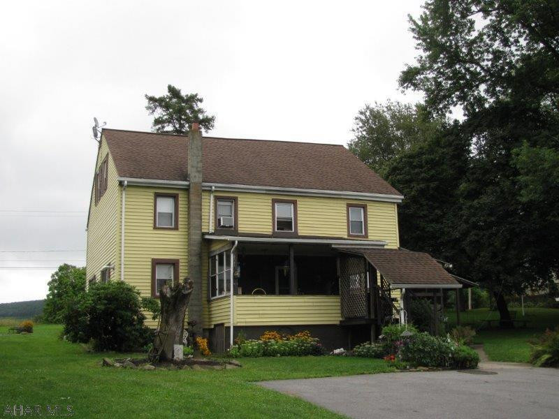 Large Tyrone home on almost 1.5 acres! This home offers a spacious living room, EIK,w/appliances, 1st floor laundry & bath! Plus 4 spacious bedrooms and updated full bath on 2nd floor! Oversized 2 car detached garage all on a beautiful property. Conveniently located midway between Altoona & State College just off I99!  Home Warranty Included!!