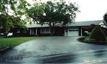 Nice 3 bedroom rancher w/ 2 bath. Brick 3 bedroom rancher, 2.5 baths, two 2- 1 car adjoining attached garages, two fireplaces- one first floor(brick)-second in basement(white brick). Flag- stone patio with fire  place/cooker. New roof.