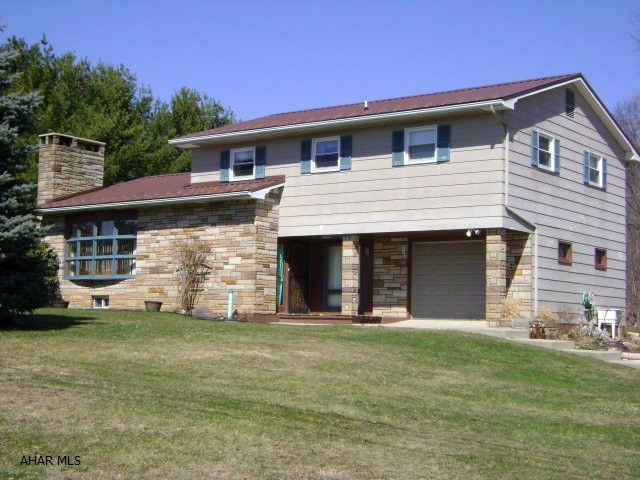 This turn-key home, in a great location, sits on a level .75 acre lot with easy access to I99, Altoona and/or Bedford.  Here you will find beautiful knotty pine walls and ceilings, spacious rooms, a large family room in the basement, a back deck that is great for outdoor entertaining and lots of garage space.