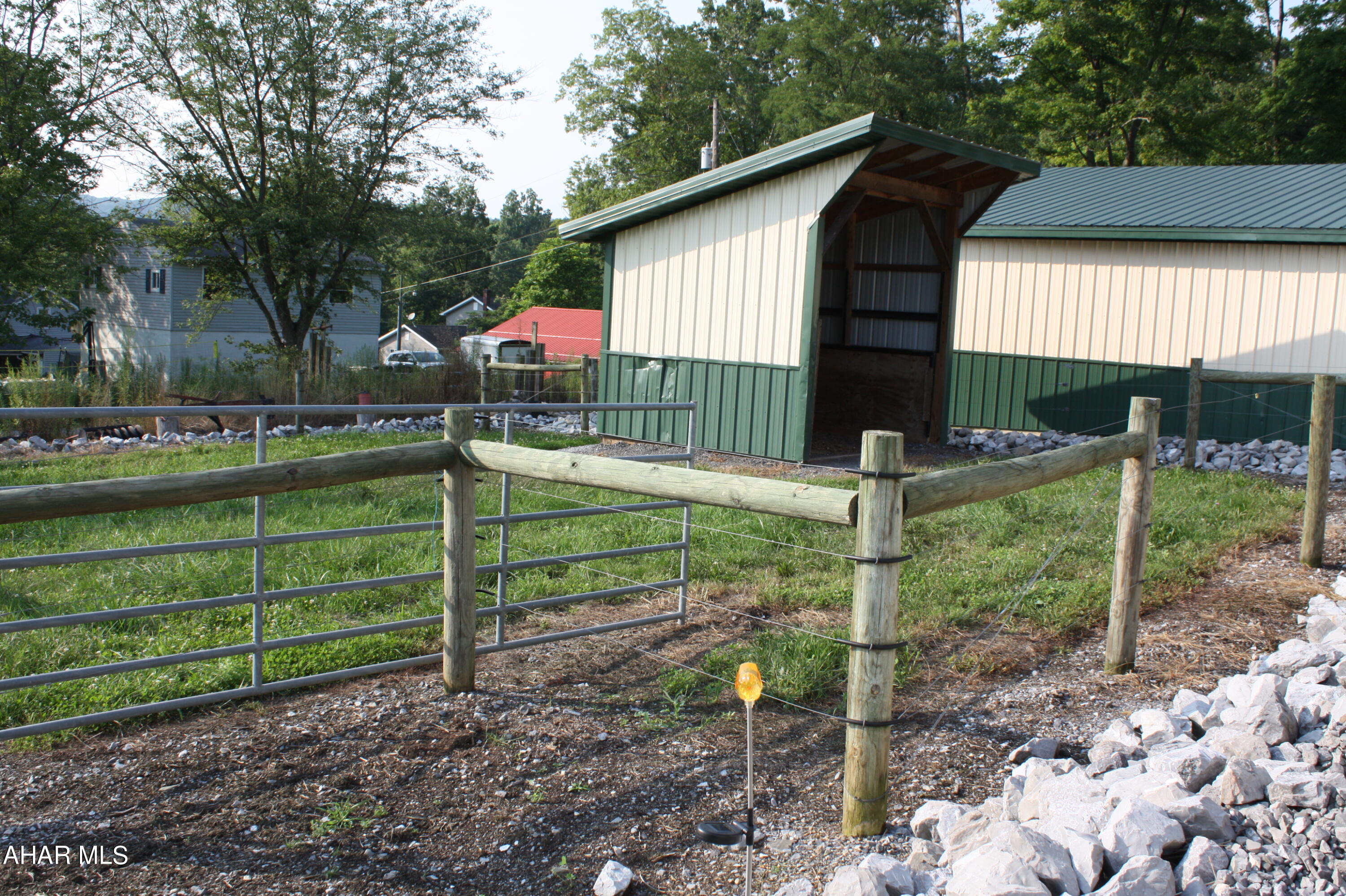 Property has 2 horse barns, 32x48 & 35x22, with metal roofs  and 3 stables. 5 fenced pastures with gates to all.  2 Lean-to's 25x48 & 4x8. heated tool shed/tac room, 12x8.  Large Machine shed for storing equipment, 16x42. 3 free standing stalls for shade for animals 16x7, 14x7, 10x10.  Well water and electric.  There is a 432sq foot heated finished room with an earth system sewer for staying. Township is running Public Sewer to this area.  Ask agent for details.  Call agent to set up a personal tour.