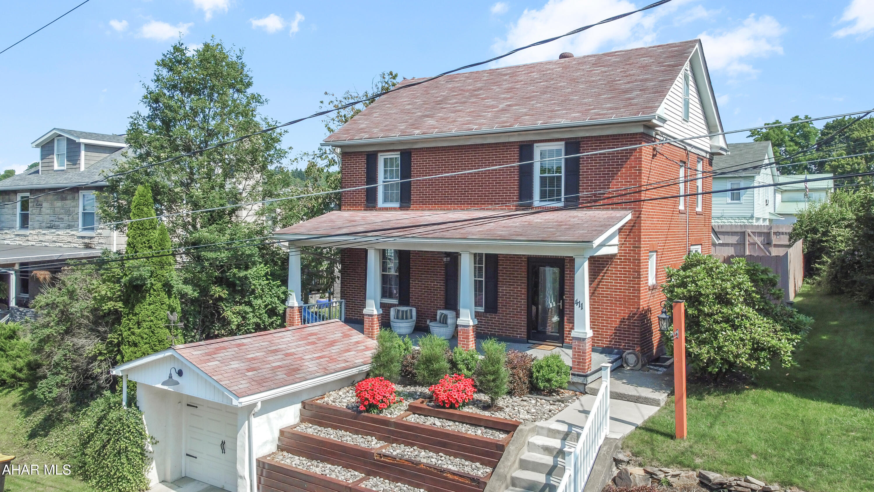 Welcome to 411 W Lloyd Street in Ebensburg Borough! This elegant all-brick home is nestled on a stunning lot, offering an array of fantastic features throughout. As you step inside, you'll be greeted by a large foyer that leads to a spacious living room, perfect for entertaining. The formal dining area is ideal for gatherings, while the kitchen boasts ample cabinetry to satisfy all your culinary needs. Conveniently located on the main floor is a half bath & an additional family room that could easily serve as a first-floor master suite. Head upstairs to find three generously sized bedrooms & a full bathroom. The basement offers even more possibilities w/ a partially finished room, plenty of storage, a laundry area, mechanicals, & a deep two-car integral garage. Outside, enjoy the beauty of meticulously maintained landscaping, a breathtaking front covered porch perfect for relaxing, & a rear fenced-in yard w/ a shed for extra storage. Don't miss out on this incredible opportunity, call today to schedule your visit!
