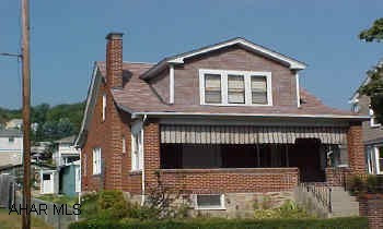 Lovely Brick Cape Hardwood w/ carpet, first floor- zoned highway business- family friendly neighborhood, some thermo pane & single with storm windows, roof new-2003. Has an enclosed porch rear