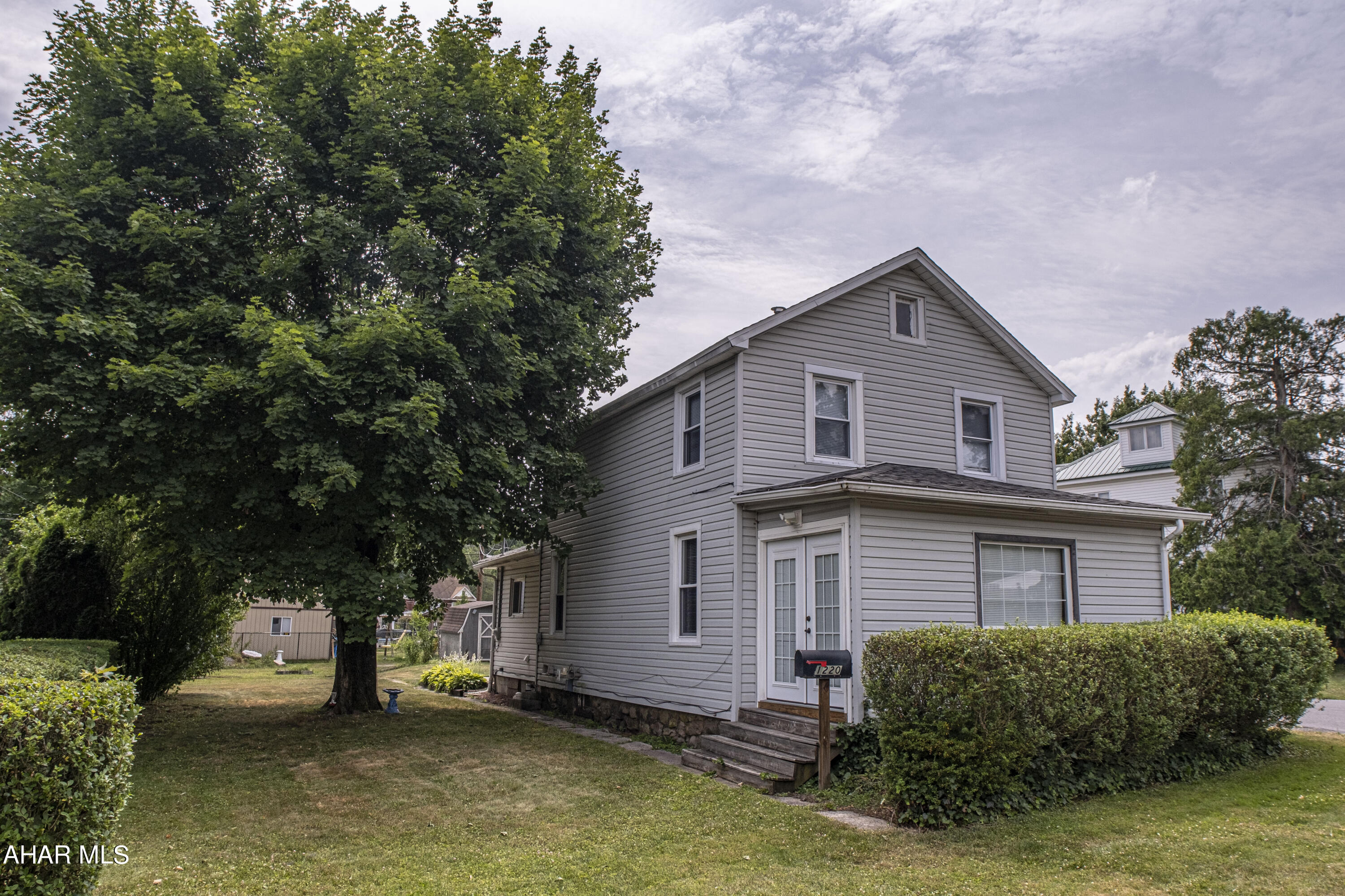 Discover this charming 3-bedroom, 1.5-bathroom home located on a private street in the heart of Bellwood, PA. This well-maintained property features newer mechanicals and sits on a level lot, providing ample outdoor space including a concrete patio perfect for entertaining. Inside, the carpeted living space offers a cozy atmosphere, with a convenient half bath and laundry room on the first floor. The third bedroom located on the first floor can be utilized as additional living space to suit your needs. Just a block away from Bellwood Antis Community Park, this home combines comfort and convenience in a desirable location. Make this delightful property your new home!