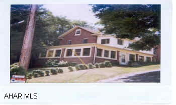 Brick/Vinyl on double lot, new exterior windows, newer kitchen, 2 baths, 2nd floor laundry, very good condition.  New water tank, enclosed wrap around sun porch, enclosed 2nd floor sun porch, wooded lot in the city,  MUST SEE!!!!