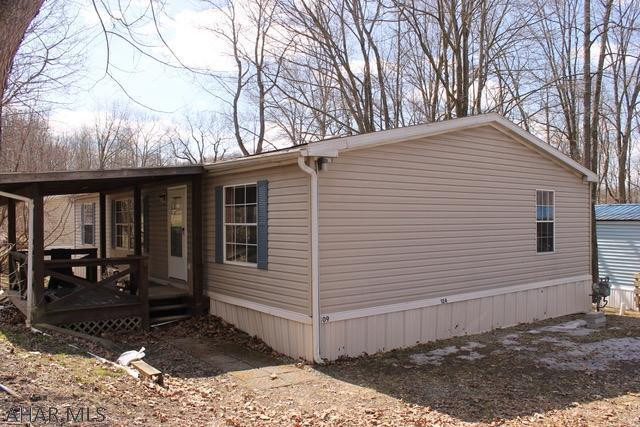 Spacious doublewide in Camelot Woods Mobile Home Park.  Open floor plan and new carpet. 6 months free lot rent!