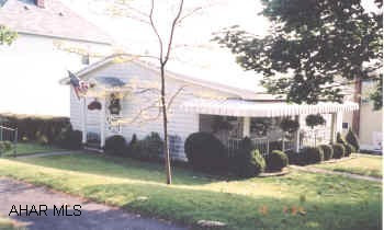 CORNER LOT. FR IN BASEMENT W/BAR AND 3/4 BATH. EAT-IN KITCHEN PLUS FDR. CARPET OVER HARDWOOD. TWO REFIG., RANGE, MICROWAVE, DW, WASHER & DRYER. BIGGER THAN IT LOOKS.