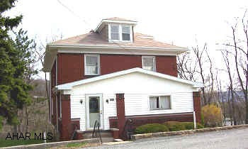 Large brick home in quiet neighborhood on a dead-end street with great views. Logan Township. 4 bedrooms, separate dining room, and enclosed porch. Home could use some updating, no off-street parking but there is room on either side of the house to cut in own private drive. PRICE CHANGE IS DUE TO INSTALLATION OF BRAND NEW SEWER PROJECT THROUGH LOGAN TOWNSHIP, SCHEDULED TO BEGIN IN MAY.