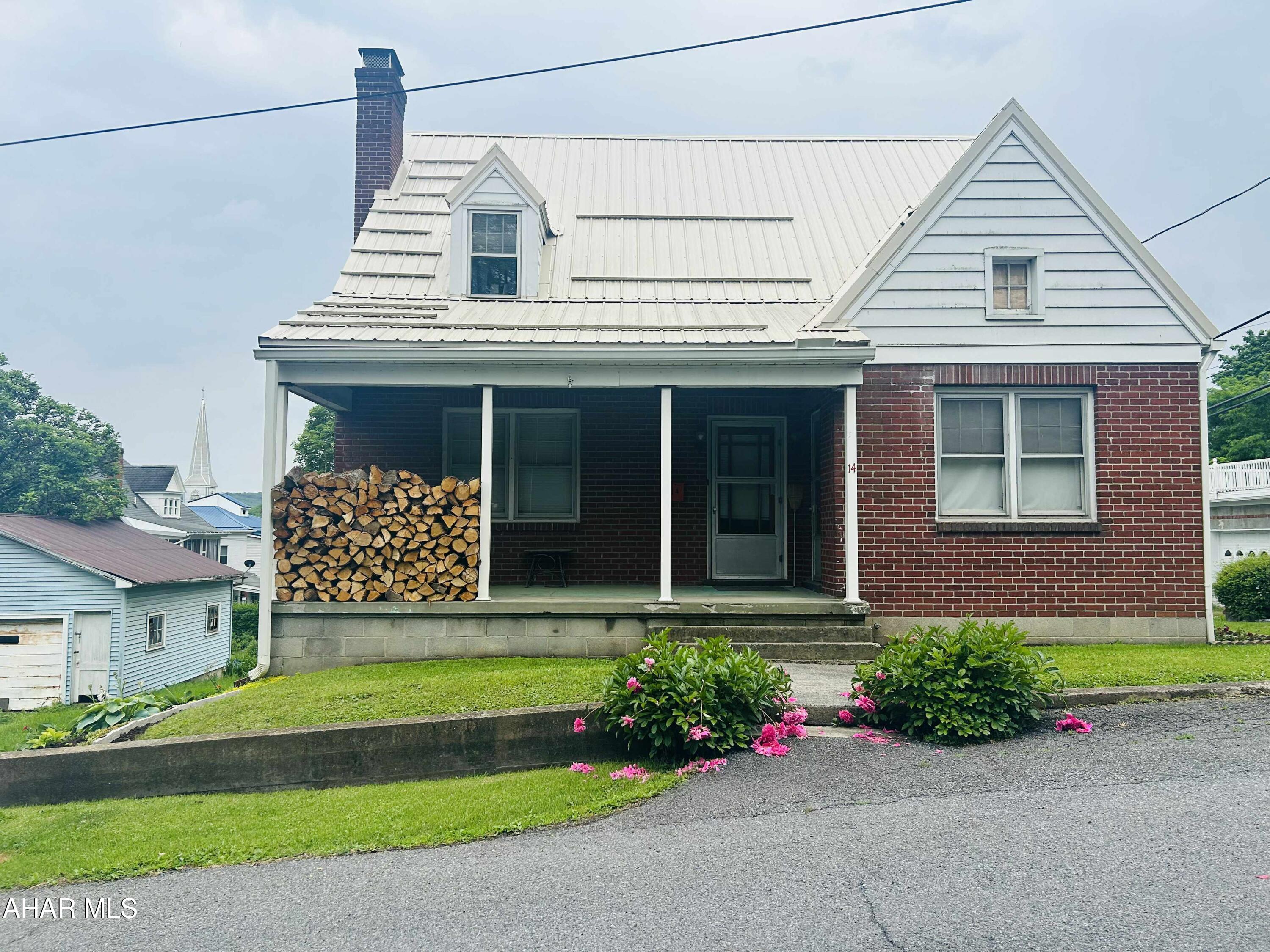 A Beautiful two-story brick house in downtown Everett is within walking distance to restaurants, grocery stores, boutiques and specialty stores. This charming house features four bedrooms, a bonus room that could function as an office space, two full bathrooms, living room, dining room,kitchen,a large, covered porch, part finished basement, attic   and garage .The spacious master bedroom features a walk-in closet .You must see the cozy house in person to appreciate all that it has to offer .