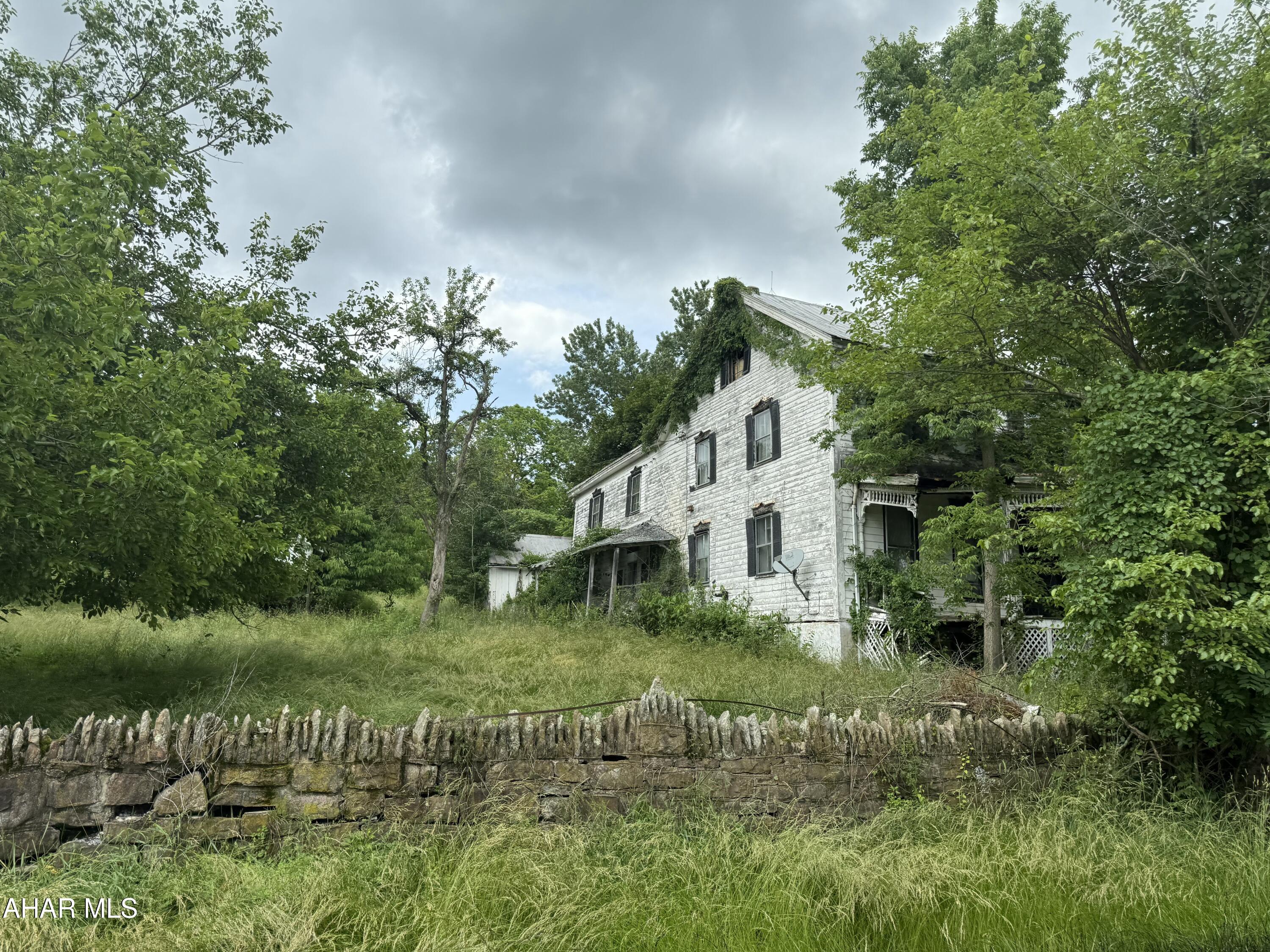 Are you looking for a restoration project or acreage to build your dream home?  Situated on 4 acres in a Turkey Valley this property has endless potential. Schedule your private tour and see what opportunity awaits!  Seller has no records or knowledge of septic/water.  It is unknown.