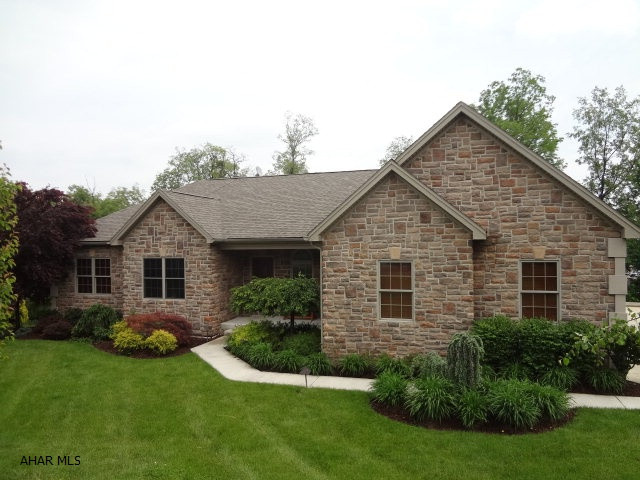 Stunning 3-bedroom, 3.5 bath ranch home in a great neighborhood.  Less than five years old, this home has everything to offer.  Meticulously maintained and landscaped on nearly one acre.  Hardwood floors and top of the line appliances.  Large finished basement with 18 foot wet bar.  Raised platform for stadium seating.  Covered deck in rear.