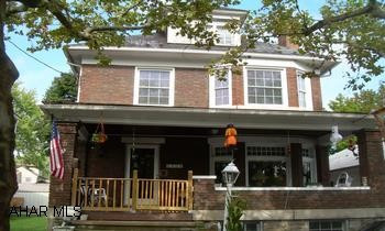 3 Story Brick Great Solid Brick home, with 4/5 Bedrooms.  Natural Wood work, Treyed ceilings and folding Beveled Glass doors to a DR.  Wood burning fireplace and a detached garage.