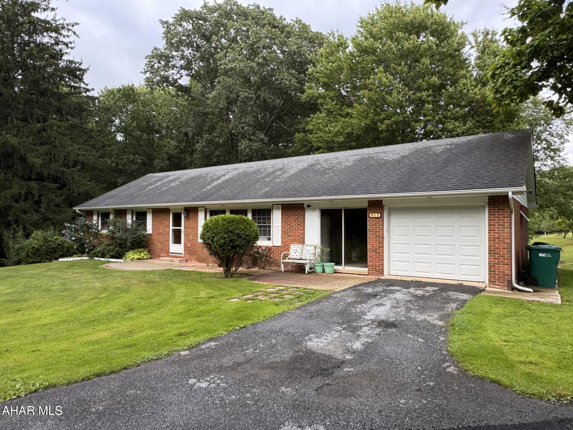 Privacy abounds with this 3 bedroom  brick ranch home with attached  1 car garage located on 29 acres with a pond.  Private paved driveway from the main road.  Second workshop building with possible additional living quarters above. Ideal for horses!