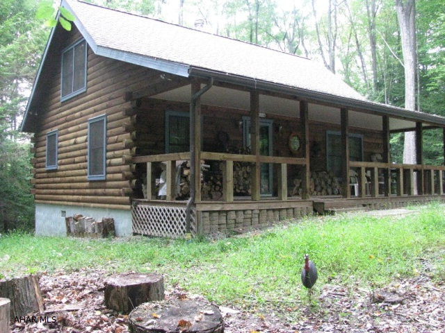 Perfect cabin for the outdoorsperson or hunter and their family.  Step out the front door of your log cabin, cross the road and step into thousands of acres for hunting or hiking in Prince Gallitzin State Park and State Game Lands 108.  With four bedrooms and 1 1/2 baths this beautiful cabin offers room for the whole family or hunting gang.  Don't miss all of the extra touches that make this home a place to relax. Electric baseboard heat is supplemented by the wood stove to warm up those chilly nights.  Cabin is adjacent to the state park and Glendale Lake.  Only six miles from Rock Run ATV Park.  You have the option of belonging to Glendale Yearound and enjoy the recreational amenities offered there (community swimming pool,basketball/volleyball/tennis courts, dog park, etc.)
