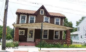 Corner property with great presence. Hardwood floors and french doors. Could be a nice office as well.