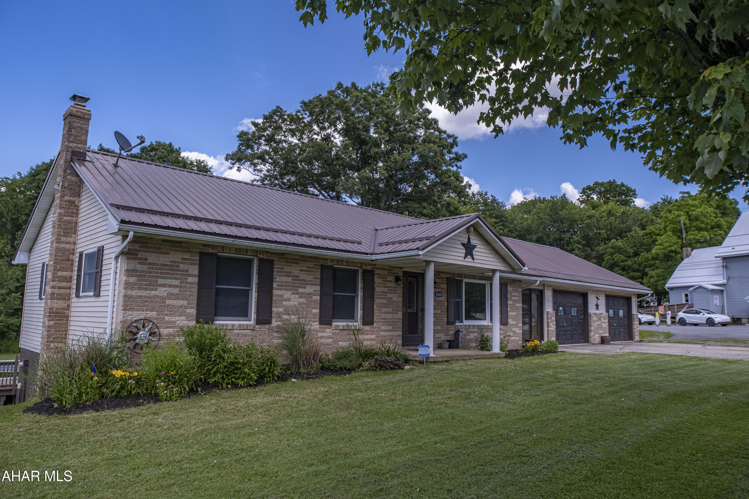 Enjoy spacious country-style living with plenty of amenities! This well-maintained, ranch home offers comfortable one-floor living with plenty of extra space.

Inside, you'll find 3 bedrooms, 1 full bathroom, and 2 half bathrooms, along with the convenience of first-floor laundry. The basement provides additional living space, including a versatile bonus room that can serve as a home office, gym, playroom, or guest area. This home is well insulated for year-round comfort and features central air, a hookup for a wood burner, a newer roof, newer hot water tank, vinyl siding, a fruit cellar, abundant storage throughout, and a full-length walk-up attic offering even more storage potential.

The oversized attached 2½-car garage includes additional attic storage, while the concrete driveway provides plenty of parking.

Step outside to enjoy the covered back deck overlooking the backyard, complete with a 27-foot above-ground pool featuring a new filter, pump, and pool deck. Garden enthusiasts will appreciate the established garden and beautiful perennial landscaping, and the storage shed offers extra space for tools and equipment.

This move-in-ready home offers the perfect blend of comfort, functionality, and outdoor enjoyment.