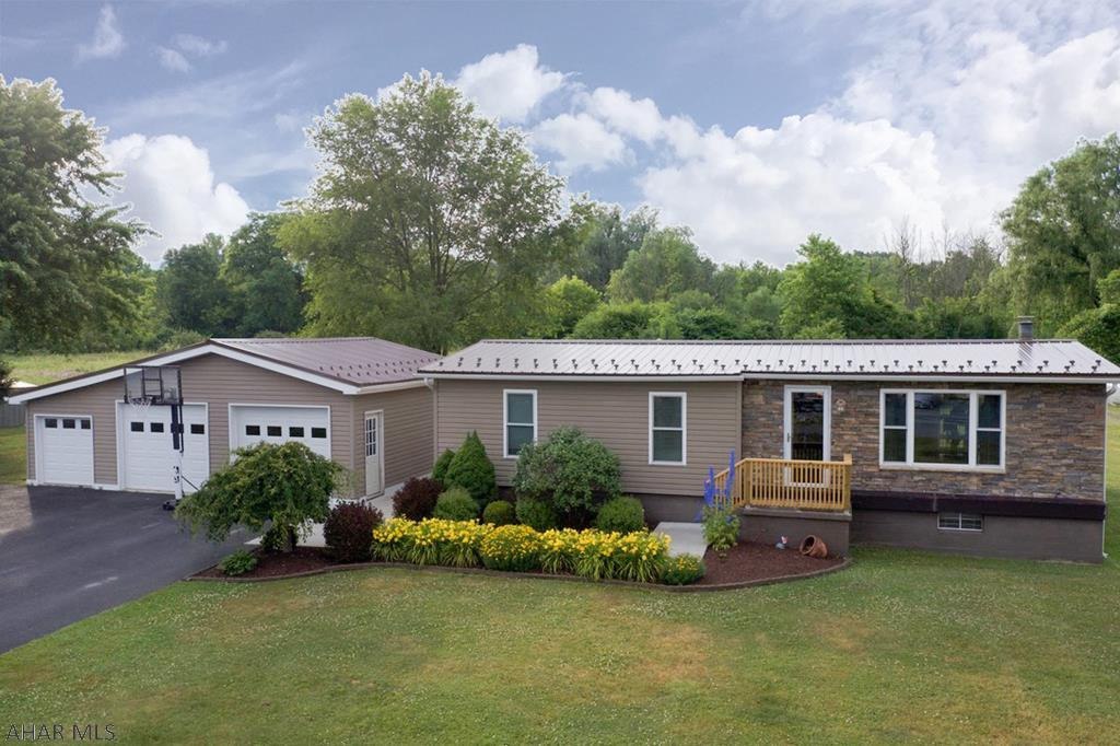 Hopefully you are ready for everything this perfectly updated home has to offer!  The main level has been completely updated and features new hardwood flooring, drywall, and insulation.  The kitchen, dining area, and living area are open to one another.  Kitchen appliances are included as well as the wood-burner.  On the same floor there are 3 bedrooms and 1 full bath.  The home has a full basement with half bath, utility room, bar, included pool table, and still has plenty of extra room for entertaining.  The home has a new roof (approx 2 years old), central air, new shed, fire pit, large flat yard, and best of all a HUGE 3 car detached garage.  The garage has updated electrical and lighting and includes a workbench and shelving.  The yard has an electric dog fence in place.