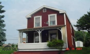 Beautiful lot, house needs some work. Shed included.