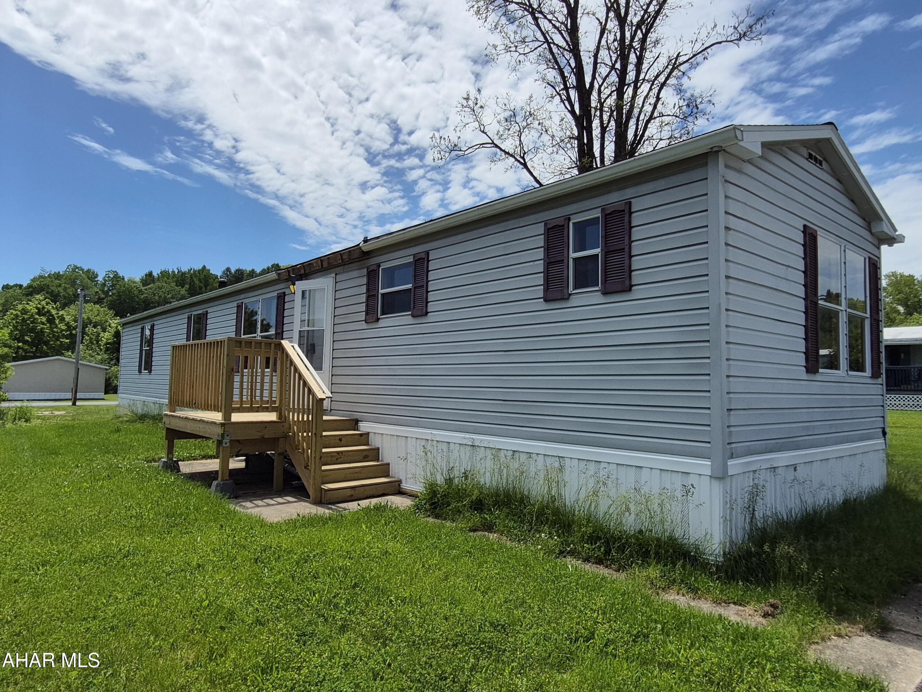 Welcome home to this beautiful Pine Grove single-wide mobile home located in Logan Ridge community in Tyrone, PA! This well-maintained 3-bedroom, 2-full-bath home offers comfortable one-level living with an inviting open-concept layout. The spacious living room flows seamlessly into the kitchen, creating the perfect space for entertaining or everyday living. The primary suite features its own private full bathroom, while two additional bedrooms provide plenty of space for family, guests, or a home office. Whether you're a first-time buyer, looking to downsize, or searching for affordable and comfortable living, this home is ready to welcome you! Seller is also offering an allowance for a new refrigerator, stove and 2 window A/C units up to $2,000.