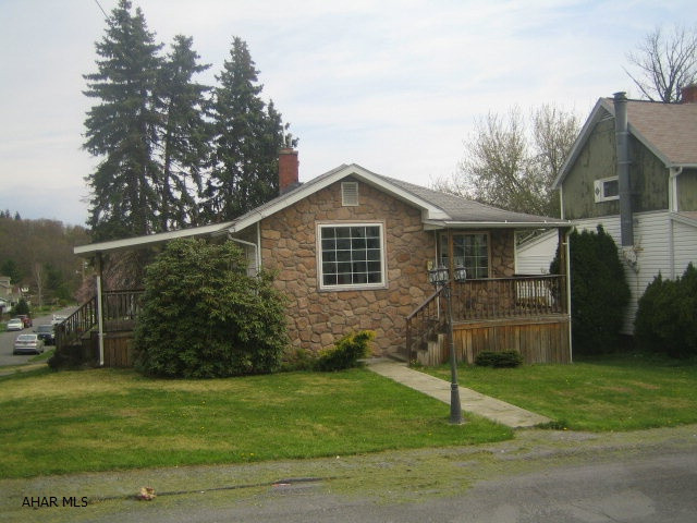 Nice 1 story stone and vinyl home in need of some TLC. Features living room and formal dining room with exposed stone walls. Updated kitchen and baths, vinyl windows, covered deck and porch, off street parking, plus finished basement with family broom and 3/4 bath. Great neighborhood in Broad Avenue extension area. Buyer pays both transfer taxes.