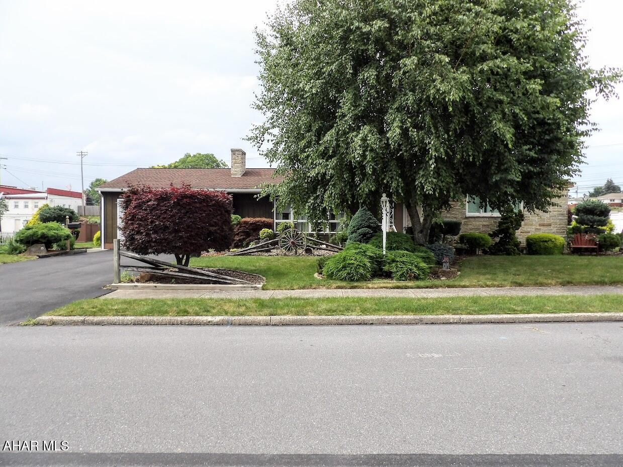 Welcome to 817 New Street in Roaring Spring, PA!

Set on 0.43 beautifully landscaped acres, this spacious home is full of possibilities. With 3 bedrooms and 2.5 bathrooms, you'll find plenty of room to live, work, and relax.

The main level features a bright kitchen that opens into a large great room with direct access to the backyard oasis, which includes a lovely gazebo and a pergola-covered patio area—perfect for shaded outdoor seating, entertaining, or relaxing.

Just off the kitchen, there is a cozy office nook that leads into a second expansive great room, offering flexible space ideal for a family room, playroom, or hobby area.

A generously sized flex room provides even more options and could serve as an additional bedroom, formal living space, or home office.

Upstairs, enjoy the convenience of a dedicated laundry room, while a former laundry hookup in the basement adds extra flexibility.

The finished basement is designed for fun and functionality, featuring a half bath, a big entertainment room, a second living area, and a dedicated exercise room. The bar area, complete with a refrigerator, stove, sink, and a pull-down projector screen for movie nights, makes hosting gatherings a breeze.

While the interior retains some dated charm, the home has been lovingly maintained and is ready for your personal touch.

Outside, enjoy the gazebo, relax under the pergola-covered patio, and take advantage of two sheds for extra storage—all surrounded by a beautifully landscaped yard.

Buyer to verify square footage, taxes, and all property details. Property sold as-is.

Don't miss this opportunity to own a spacious, versatile home with so much to offer in Roaring Spring!