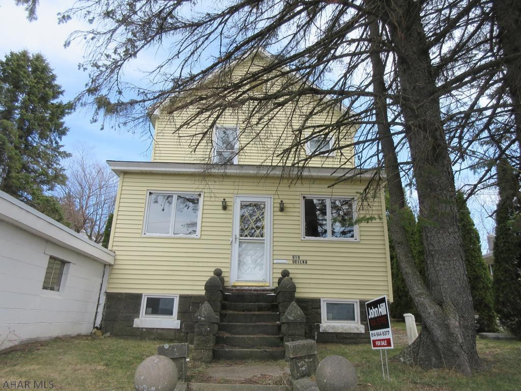 Gallitzin 2 story vinyl home with large living room, formal dining and spacious kitchen. Enclosed front and back porches, 1 car attached concrete block garage and storage shed.  Buyer responsible for required municipal sewer testing and escrow/repairs.