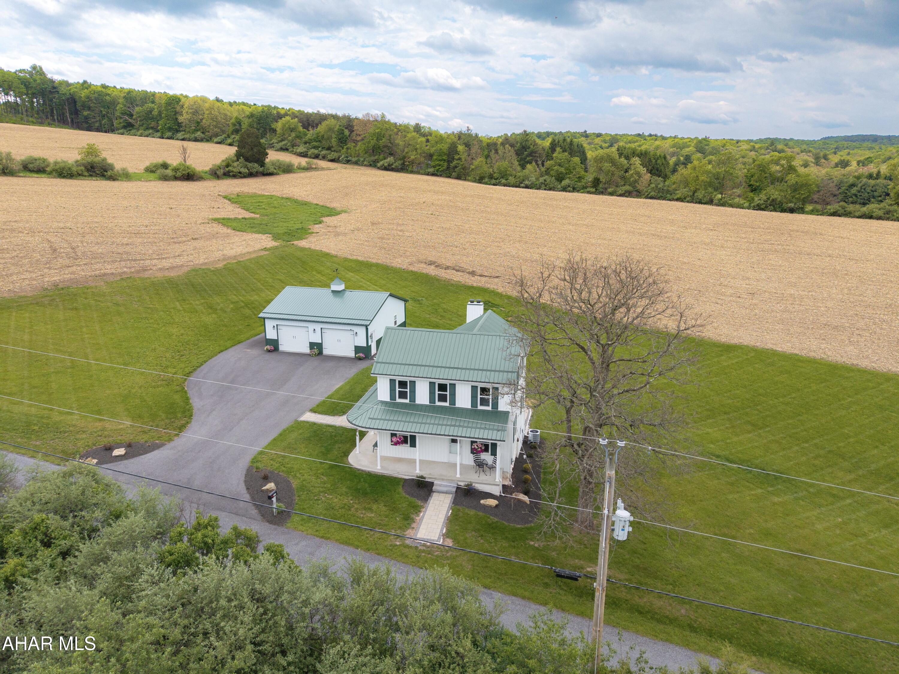 Escape to your own private oasis with this beautifully restored country estate nestled on 12 +/- scenic acres in the heart of Bedford County. Thoughtfully transformed from the ground up, this exceptional property blends timeless character with luxury modern upgrades, breathtaking countryside views, and the kind of peace that is becoming increasingly rare to find.

Wake up each morning to rolling country views, the peaceful sound of birds chirping, and sheep grazing nearby, a setting so serene it is difficult to fully capture in words. From the moment you arrive, the property offers a sense of calm and privacy that makes everyday life feel worlds away from the stress of everyday living. Whether enjoying coffee on the wraparound porch, watching the sun rise over the countryside, or relaxing in the quiet evenings surrounded by nature, this property was designed for those seeking peace, beauty, and space to truly unwind.

Beautifully landscaped and surrounded by scenic mountain and countryside views, the setting feels like your own private retreat while still offering the comfort and convenience of a fully renovated home in turnkey condition. Conveniently located with easy access to the Pennsylvania Turnpike, Interstate 70, and major travel routes, the property allows convenient access to Washington DC, Virginia, and Maryland while still enjoying the tranquility of country living.

Bedford County is known for its historic charm, scenic countryside, beautiful covered bridges, mountain views, and peaceful backroads that make this area one of Pennsylvania's hidden gems. Rich in history and natural beauty, the county offers a lifestyle filled with small town charm, outdoor recreation, and breathtaking scenery year round.

12 beautiful scenic acres
Oversized insulated garage with utilities
Extensively renovated
Luxury kitchen and baths
Professional landscaping and hardscaping
Wraparound porch with stunning countryside views
Peaceful country setting filled with natural beauty
Turnkey condition

A rare opportunity to own a private Bedford County retreat where all the hard work has already been done and the peaceful lifestyle you've been dreaming of is waiting for you.