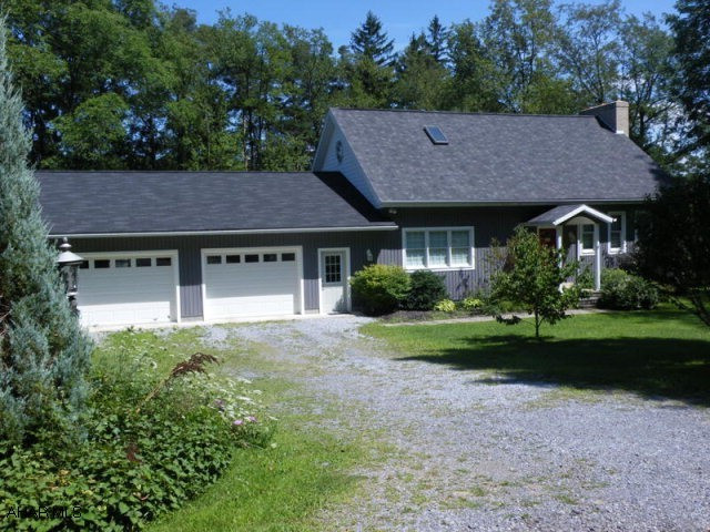 Magnificent 4 BR, 2 bath home on 2.5 acres. Oak kitchen, wood fireplace, cathedral ceilings, master bath with Jacuzzi tub hardwood floors & attached 2 car garage with 10 ft wide garage doors. A must see!