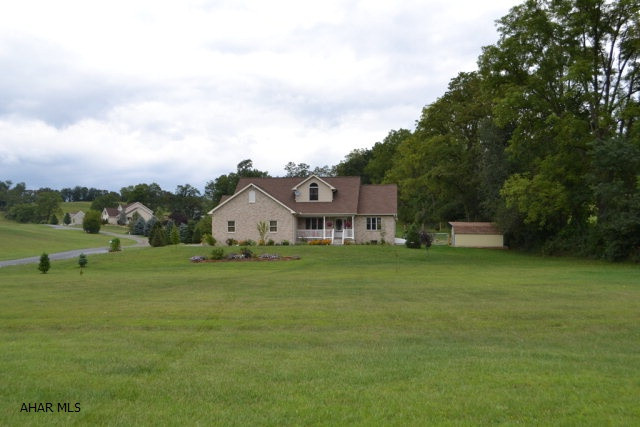 Beautiful 1.5 story brick and vinyl home situated on 2.02 acres. First floor master suite with large master bath that includes a Jacuzzi tub, separate shower stall, double sinks and large walk in closet. Hardwood floors and built in entertainment center in living room. Kitchen offers a built in desk, awesome island and a nook with French doors leading to a deck and fenced in back yard. This is a must see house.