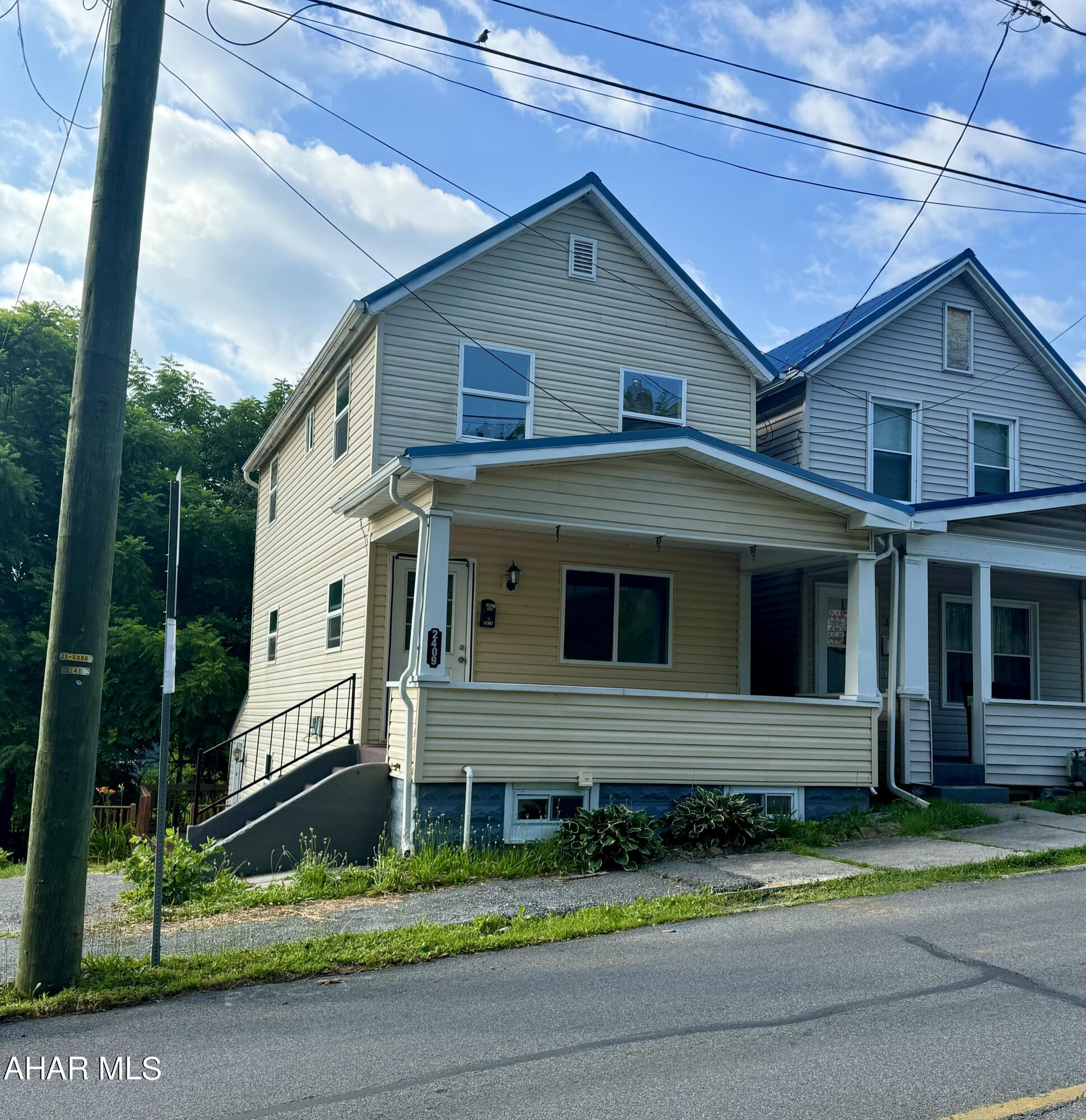 This 3-bedroom, 2-bath house is move-in ready! It features a large private yard and a spacious kitchen. The finished basement provides additional living space, with a recently renovated full bathroom and separate laundry room. The sunroom is offers plenty natural light. A lovely deck just off of the sunroom overlooks the backyard, and there is off-street parking for multiple cars. There is new carpet throughout and a newer metal roof!