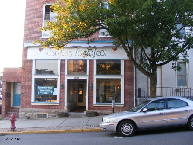 Beauty shop leased for $1300.00 month. Basement apartment rents for $500.00 month. 2nd and 3rd floors down to studs - could be 2 or 4 apartments upstairs. New roof.
