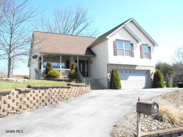 Split level ranch with hardwood floors, cathedral ceilings and skylights.  Great room floor plan consists of LR/DR & oak kitchen.  This is an as is-where is sale.  Seller makes no representations or warranties as to condition of the property improvements or appurtenances.  Buyer to pay $299 technology fee to HUBZU.com at closing.