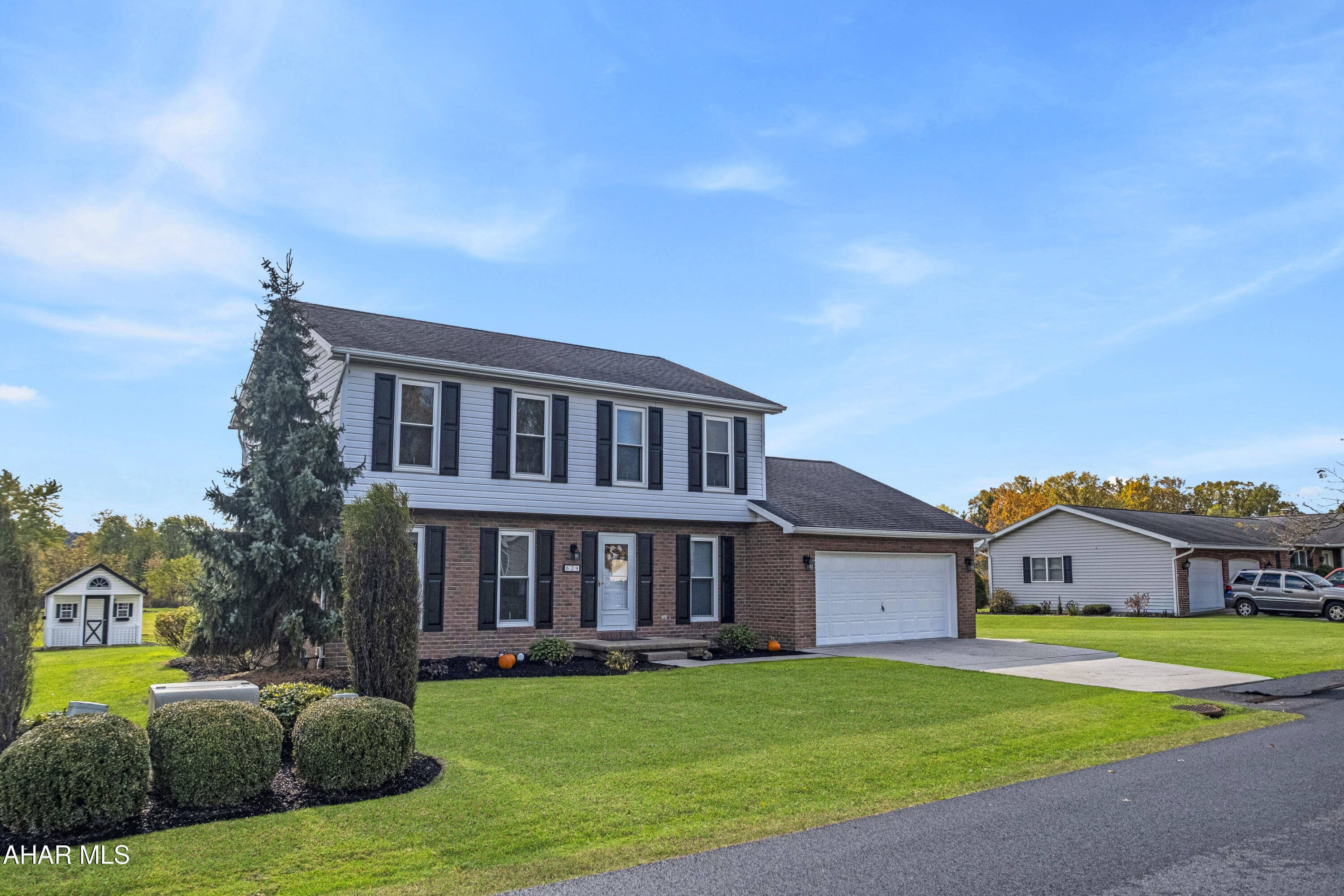 Welcome to 629 Aspen Lane - Where Style Meets Comfort in Woodland Terrace! Nestled in the desirable Woodland Terrace subdivision of Duncanville and within the sought-after Hollidaysburg School District, this move-in ready gem offers 4 spacious bedrooms, 2.5 updated baths, and over 2,150 square feet of beautifully refreshed living space. Step inside to discover a flowing floorplan featuring a formal dining room, a bright living room, and a cozy family room with a charming fireplace that leads to a private patio retreat - perfect for entertaining or unwinding. The owner's suite boasts a private bath, while the kitchen shines with brand-new stainless steel appliances and modern fixtures. Enjoy the ease of a 21'x22' attached garage, a handy shed, fresh paint throughout, and stylish new flooring that ties it all together. Clean, crisp, and full of natural light - this is the home you've been waiting for!