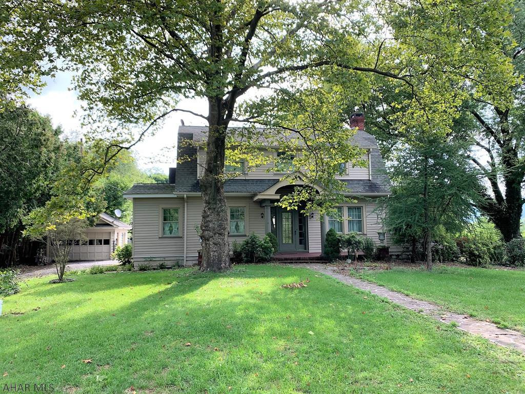 Stately 1920's era Dutch Colonial home resting on the outskirts of the Downtown Bedford area. Main level features an entry foyer w/ open staircase, living room w/ hardwood floors & fireplace, kitchen offering granite counters, s.s. appliances, & tiled backsplash, dining room w/ built-ins and glass french doors, family room w/ bar, den with surrounding windows, full bath, and a mud room. Second level offers a owner's suite with ensuite bath and closet, two additional bedrooms and a full bath w/ clawfoot tub. Guest cottage that would make a perfect Airbnb, in-ground pool, flagstone walks & patios, & lily pond. Oil HW heat, heat pump & central air. Full walk-out basement and a detached one-car garage. Convenient location close to all amenities but rests on a large 1.54 acre lot. Ready to go!!
