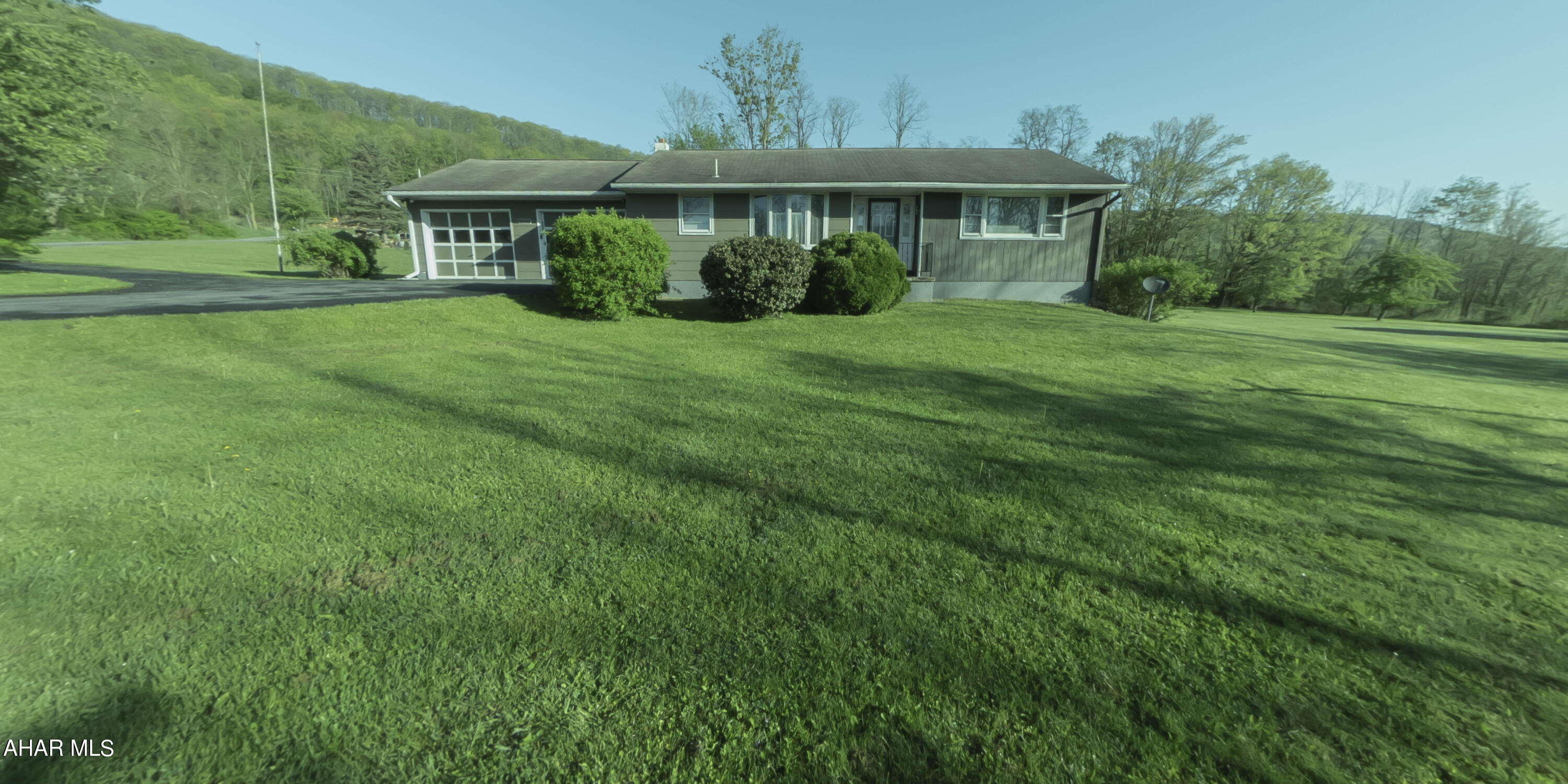 Welcome to this exquisite ranch-style home nestled on a lush 1.07-acre lot in the picturesque Hobbit Hollow neighborhood in Tyrone Township. 127 Hedberg Lane boasts a harmonious blend of comfort and convenience, making it a true gem in this scenic community. Interior Highlights: Living Room: Bask in natural light from the large window offering views of the beautifully manicured southeast lawn. The room is finished with elegant hardwood flooring, creating a warm, inviting atmosphere. Kitchen: Culinary enthusiasts will appreciate the vinyl flooring, generous counter space, and modern appliances including a gas range, built-in dishwasher, double stainless steel sink, and refrigerator. Bathroom: Features practical tiling, a shower over tub, and safety-enhancing grab bars at the toilet and bath, blending functionality with style. Additional Features: Two-Car Garage: Ample space for vehicles and additional storage. Covered Rear Patio: Perfect for relaxing and entertaining outdoors. Flexible Space: The lower level offers a potential fourth bedroom, ideal for guests or as an office. Utilities: Equipped with oil heating, gas for cooking, and hot water, ensuring comfort throughout the seasons. All-Inclusive Appliances: All kitchen appliances are included, adding convenience to your move. Situated in the serene Tyrone Township, this property is not just a house but a welcoming home ready for new memories. Enjoy the peace and beauty of Hobbit Hollow, with all the amenities needed for a comfortable lifestyle.