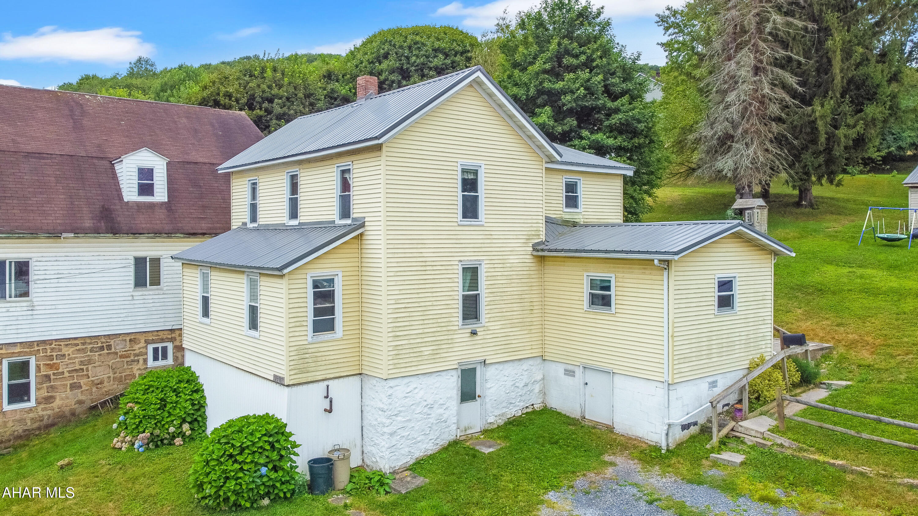 Welcome to 1300 Lloyd Street, a charming home w/ recent updates & incredible potential! This residence boasts a newer metal roof, furnace, hot water tank, & an updated kitchen, among other improvements. The main floor features a spacious living room, a large kitchen w/ a pantry & first-floor laundry, a full updated bathroom, a dining room, & two versatile bonus rooms, including an office. Upstairs, you'll find four bedrooms (one being captive), a master suite w/ a half bathroom & kitchen hookups. The unfinished basement provides excellent storage space, while the corner lot offers an expansive yard & a large shed for additional convenience. Please note that this home is being sold ''AS-IS'' due to foundation damage. Call today for more information!