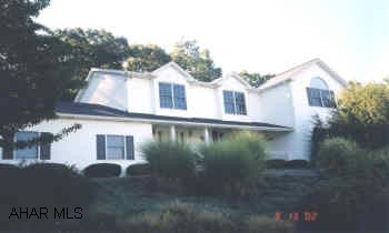 HLBG/FRANKSTOWN TOWNSHIP WITH BREAKTAKING VIEWS OF SCOTCH VALLEY.  HLBG/FRANKSTOWN TWP.  1.5 ACRES WITH MAGNIFICENT VIEWS OF SCOTCH VALLEY.  4 BEDROOM, 2.5 BATH WITH ALL THE AMENITIES.  SPACIOUS ROOMS EACH WITH GORGEOUS VIEWS.  TOTALLY UPDATED IN 1995.  ALL MECHANICS UPDATED.  BACK UP ELECTRICAL HEAT.