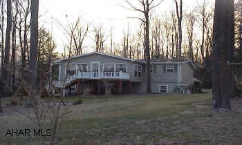 Great manufactured home with addition. 3 brs. 2 bths, fireplace, whirlpool tub, central air, large landscaped corner lot. Shed. Basement partially finished.
