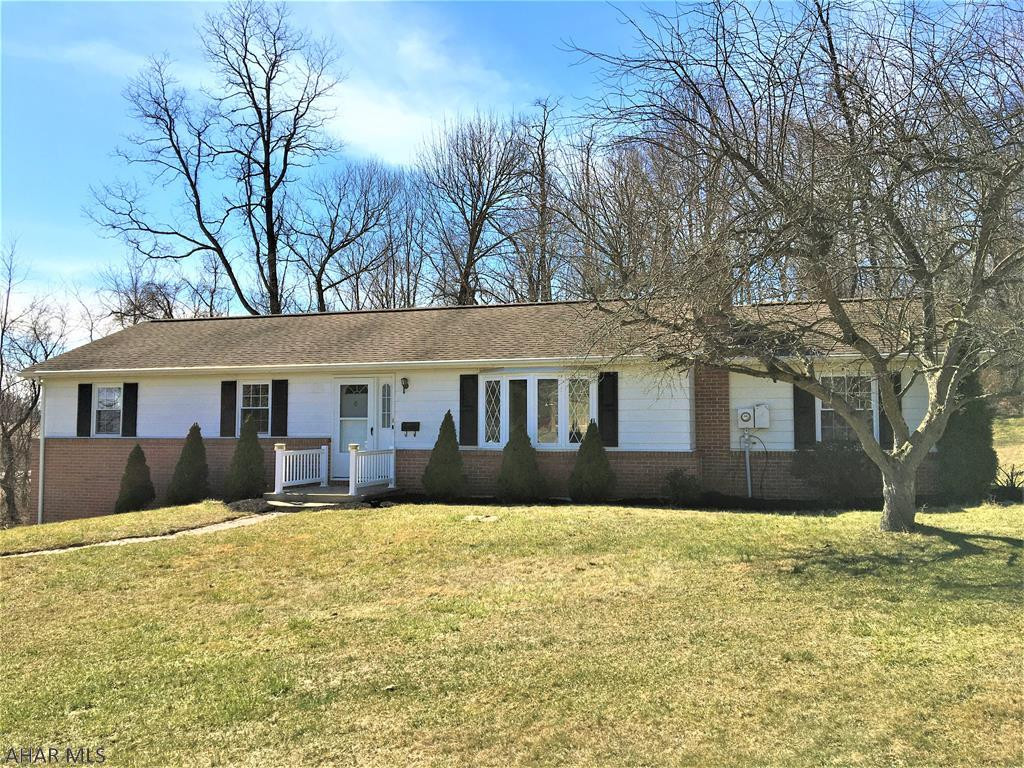Hard to find Rancher with almost an acre of yard. Completely re-painted  through out and all new flooring on the main floor and bsmt level, plus much much more!!  Large kitchen for family dinners with new countertops ,sink, dishwasher and stove Cozy family room with brick accent . Living room with brick wood fireplace. Dining area and extra bonus room which could be a den or office. 3 bedrooms and 1 full bath complete the main level. Fully finished basement has extra family room, laundry room. 3/4 bath and oversized 1 car garage. Garage has been freshly painted, new garage door and cement floor painted. Easy care landscaping , nice rear patio with roll out awning. Close to shopping and hospital and more conveniences. Take a look at this one, it is simply lovely!!