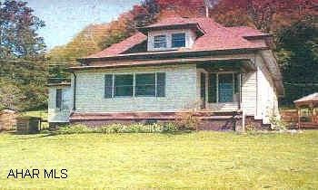2 1/2 story home on 5 1/2 acres w wrap-around deck. To much to mention. BEAUTIFUL rural home