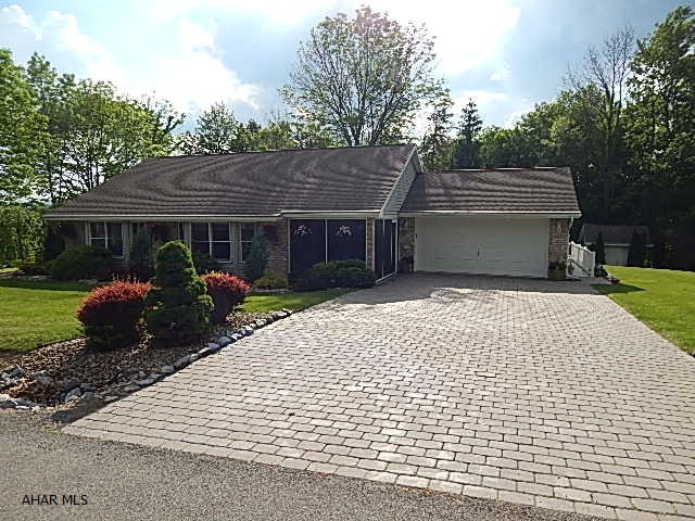 This is a beautiful very well maintained one level home with all the furniture included. There is a two car garage large maintenance free vinyl deck with all the patio furniture included. This is an ideal home for a retired couple. The lot is nicely landscaped, with a shed. Brick driveway.