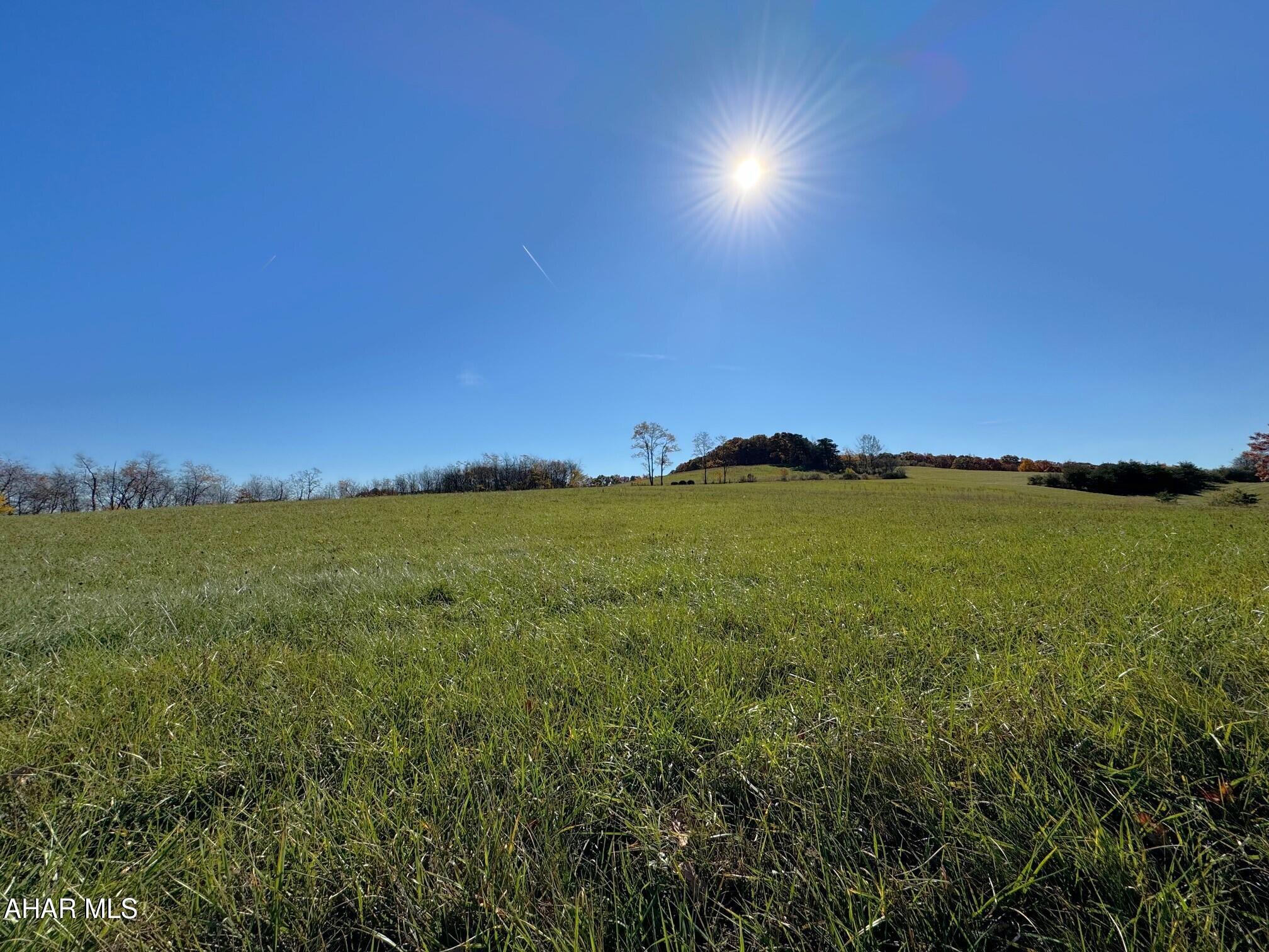 Absolutely beautiful 30.279 acre land parcel offering stunning views of the surrounding countryside. Situated just atop Tulls Hill, it contains open rolling meadows and wooded land with a nice mixture of hardwood trees. This would make an ideal building site for that gorgeous new home!! Great for hunting, agricultural production, that get away spot for a cabin or simply enjoying wildlife and panoramic views. Just minutes from Shawnee State Park and Historic Downtown Bedford. Public road frontage along Tulls Hill Road and also Old State Route 30. Land has not been percolation tested. Electric is at the road.