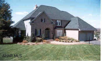 New construction.. Photo is of finished home with same design/ layout. Exquisite 4-5 bedroom home in Fox Hollow. Over 4000 sq ft of quality. 1st Floor fam. room with gas fireplace, formal LR and DR, 4 bedrooms on 2nd floor with adjoining baths, finished basement has large family room with a 2nd gas fP and addditional room for 5th bedroom with full bath. All Corian kitchen and baths, front and rear staircases, wrap around deck, two screened porches and spectacular view!