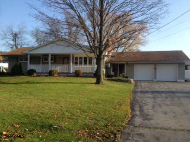 Freshly painted Ranch with breezeway and attached 2 car garage.  Natural gas available - (3) - 275 gal oil tanks - full & propane for heater on enclosed rear porch.  Beautiful oak kitchen with built-in hutch, new carpet, woodburning fireplace in living room, large covered front porch.  Priced to sell.  Detached 2 car garage with bonus room, detached motor home - garage and shed.  Woodburner in breezeway, new garage doors, hardwood under carpet.