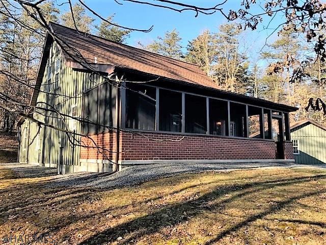 If you're looking for the ultimate get-a-way property look no further!  This well built, well maintained cabin/house rests on 20 wooded acres and is close to thousands of acres of state lands.  It features a great room with cathedral ceiling and fireplace, kitchen, dining room, one bedroom on the main level and one on the second and two full baths.  Beamed ceilings, knotty pine walls & pine board floors.  Large screened in porch for relaxing and listening to nature and rear concrete patio.  Heat pump with central air-conditioning, private well and private sewer system.  20' x 26' horse barn with electric that can easily convert into a garage.  If you love the outdoors, this is the place for you.