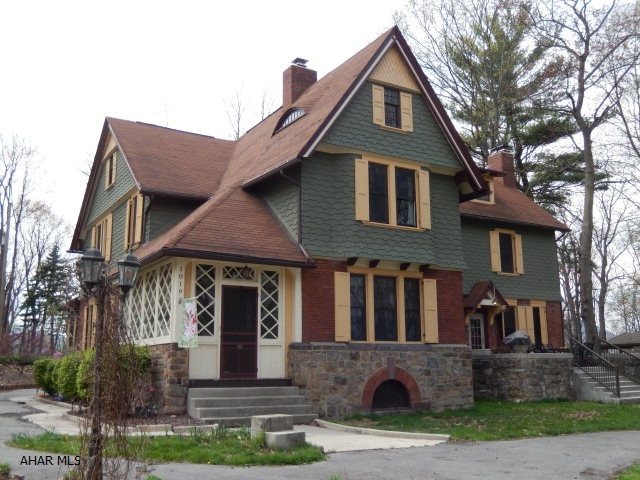 Location, Location & Character!!Unique turn of the century home! Unique setting! Lovely secluded 5 acres ... yet close to everything. This large beautiful home is one of a kind. It features large rooms, refinished wood floors, 3 fireplaces (one is a Chipendale). Family Room, Office and Laundry RM on the first floor. The second floor features 3 very large bedrooms, nursery, and spacious lounge area. The spacious level grounds include pavillion, flower gardens, barn/garage, chicken coupe... so many possibilities including horses. Some updates include: Newer windows, hot water heater, oil furnace, coal furnace, fireplace wood burning inserts with blower, insulaion and stainless steel appliances. This home was updated with the period in mind. Just Stunning. Must see!!!