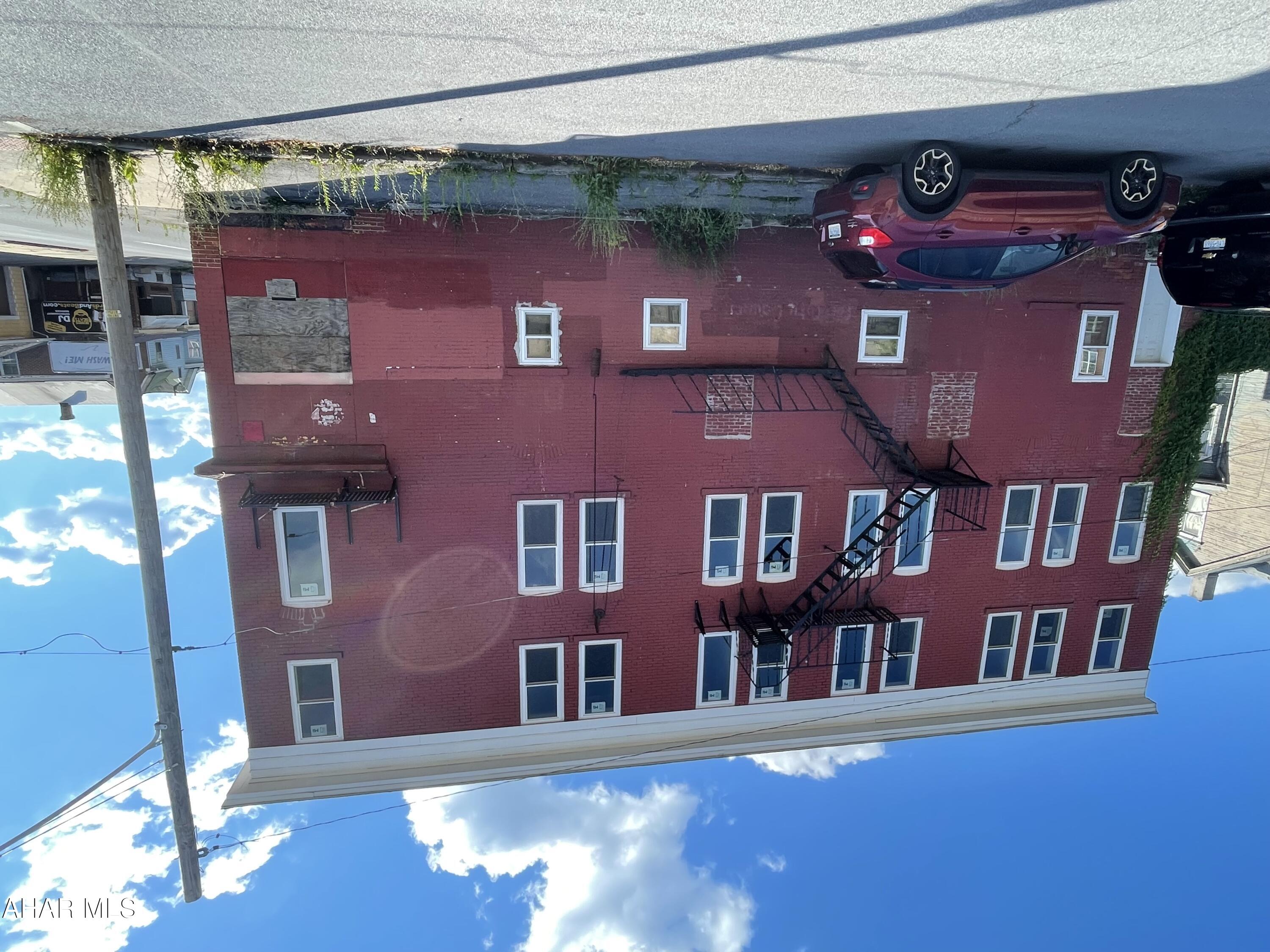 Investors! 70% Remodeled, 6 Unit-3 Story, High End Apartment Bldg. Each Floor has two Units. First Floor 2 Units are ADA. All Apts have 2BR, Full Bath, Eat-In Kitchen & Living Room. Approx 800 sq ft each. Units have their own 125 amp Electric Panel Box, and wall mounted Water on Demand Water Heaters. The Building has 200 amp service. Basement is heated. Building has rough-in Plumbing & Wiring including Fire Alarms. There is a Furnace for each floor with individual Thermostats. Windows are new insulated dbl hung and casement. New subfloors throughout. Next to the building is a foundation for a Laundromat or Off St Parking. Property is being Sold As Is. New Appraisal Report is available by request to Serious, Qualified Buyers only. Appraisal Report has projected Income & Expenses. Showings by Appointment Only.