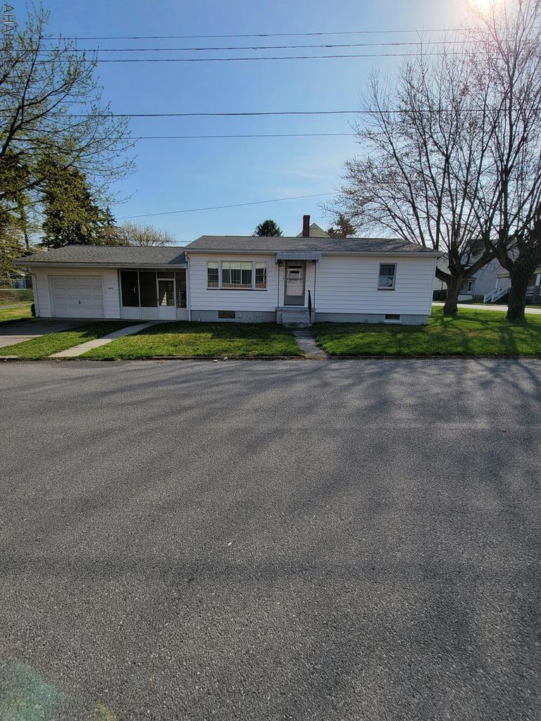 This charming 2BD 1 BA offers a flat corner lot and a 1 car detached garage. The dining room is open to the kitchen so you can entertain while you are in the kitchen! Spend your summer evenings or mornings on the breezeway that connects the house and the garage. Hardwood floors under the carpet! The unfinished basement offers lots of potentinal. Located in the Fairview area, this home is close to the playground and many amenities! Call today for your private tour.
