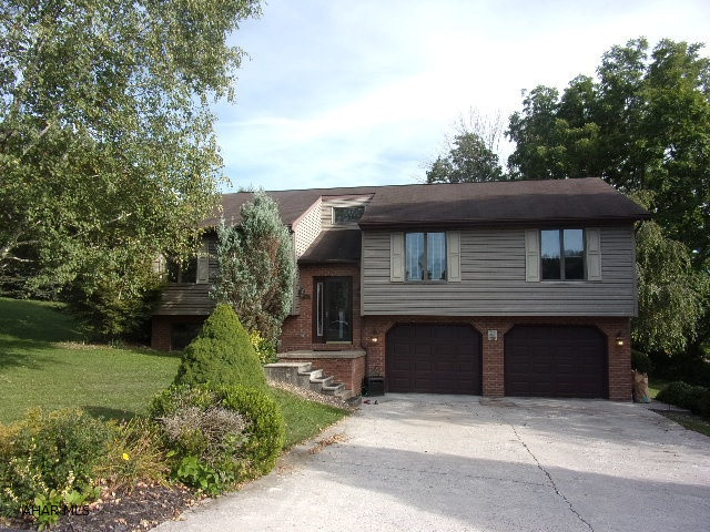 A rare find! Charming bilevel on corner lot in Bellwood Antis School District.  Great open concept first floor with vaulted ceilings and skylight in main bath.  3/4 master bath has been redone with tile shower, granite sink and tile floor.  Brazilian cherry floor in bedroom.  Lots of entertaining room in the lower level family room with a brick gas fireplace, and a wet bar with fridge and stools included!  Relax on the rear deck overlooking a .295 acre lawn.