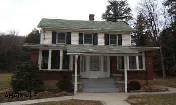 Cozy two bedroom home on 6.2 acres.  Oversized two car garage with mechanics pit.